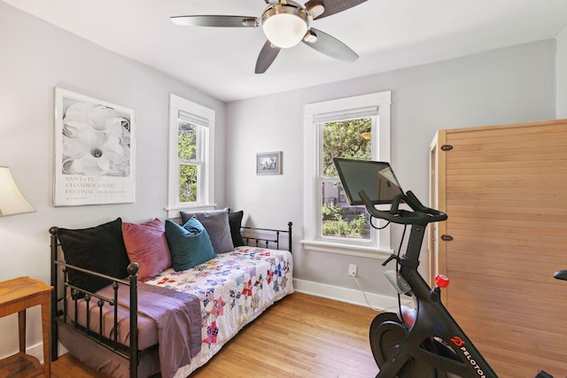 4356 Nokomis Ave, Minneapolis, MN 55406 - bedroom featuring multiple windows, wood finished floors, and ceiling fan