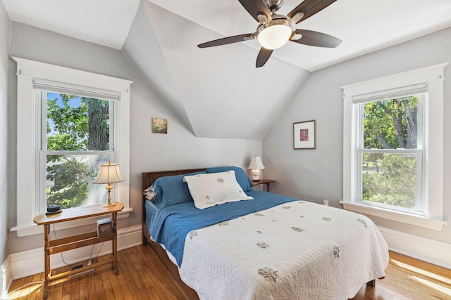 4356 Nokomis Ave, Minneapolis, MN 55406 - bedroom with hardwood / wood-style floors, multiple windows, and vaulted ceiling