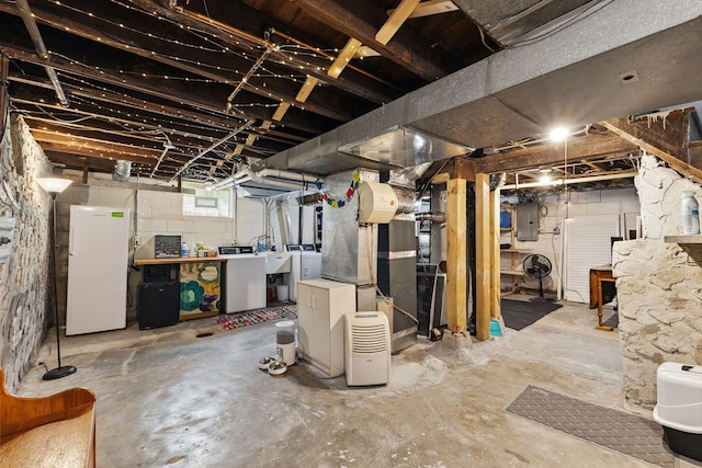 4356 Nokomis Ave, Minneapolis, MN 55406 - below grade area with electric panel, freestanding refrigerator, and washing machine and dryer