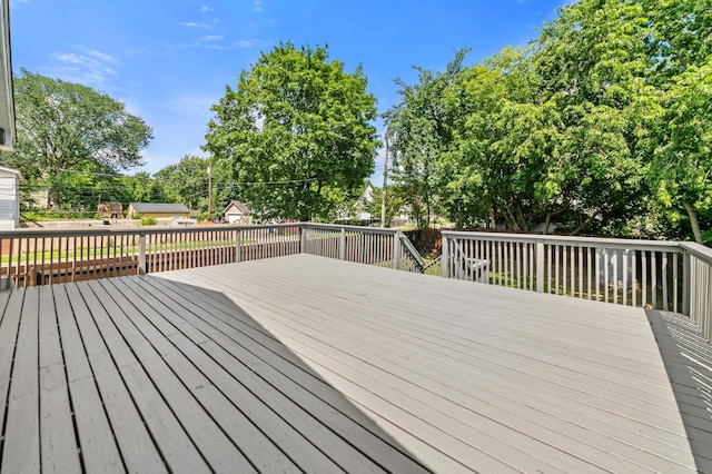960 Burr St, Saint Paul, MN 55130 - wooden deck with view of scattered trees