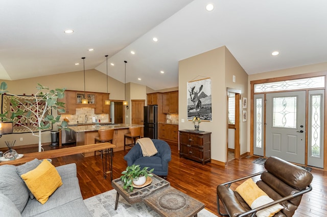4089 Stone Point Dr NE, Rochester, MN 55906 - living area with dark wood-type flooring, recessed lighting, and high vaulted ceiling