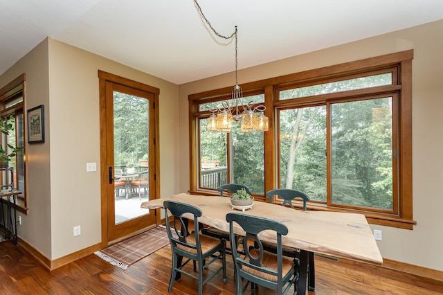 4089 Stone Point Dr NE, Rochester, MN 55906 - dining area with a chandelier, healthy amount of natural light, and wood finished floors