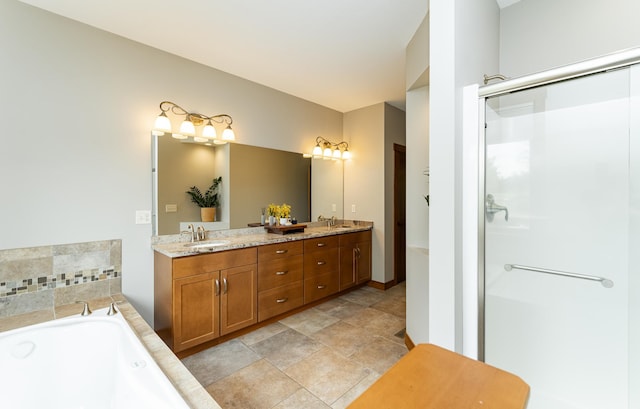 4089 Stone Point Dr NE, Rochester, MN 55906 - bathroom featuring double vanity, a garden tub, a shower stall, and stone finish flooring