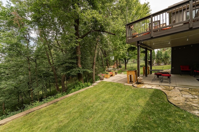 4089 Stone Point Dr NE, Rochester, MN 55906 - view of green lawn featuring a patio and a deck