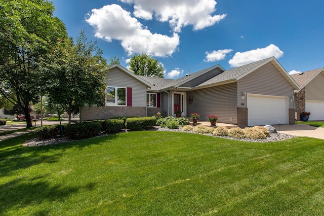 5551 Nancy Ln NW, Rochester, MN 55901 - ranch-style house featuring a garage, brick siding, and a front yard