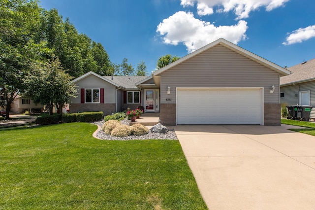 5551 Nancy Ln NW, Rochester, MN 55901 - ranch-style home featuring brick siding, a garage, driveway, and a front yard