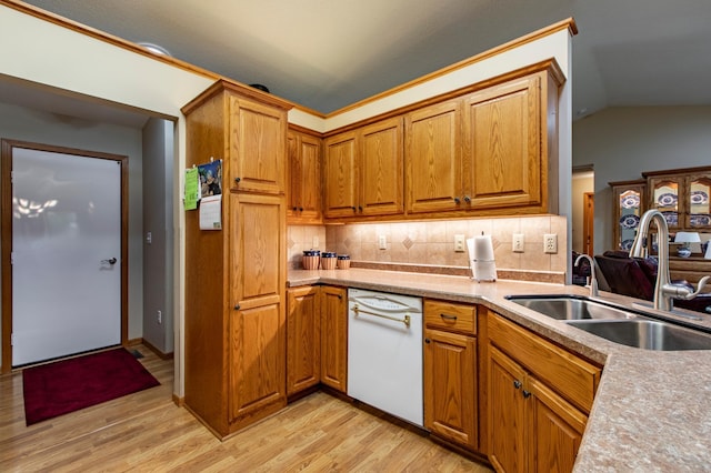 5551 Nancy Ln NW, Rochester, MN 55901 - kitchen featuring white dishwasher, light wood-type flooring, decorative backsplash, brown cabinetry, and light countertops