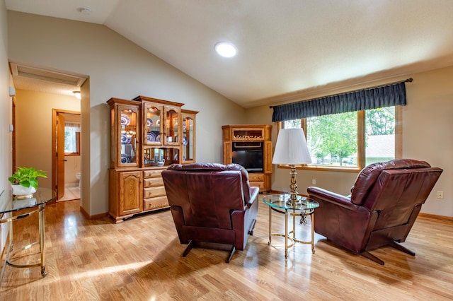 5551 Nancy Ln NW, Rochester, MN 55901 - living area featuring lofted ceiling, light wood-style flooring, and recessed lighting