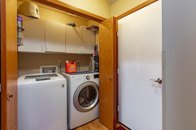 5551 Nancy Ln NW, Rochester, MN 55901 - washroom with washer and clothes dryer, cabinet space, and light wood finished floors