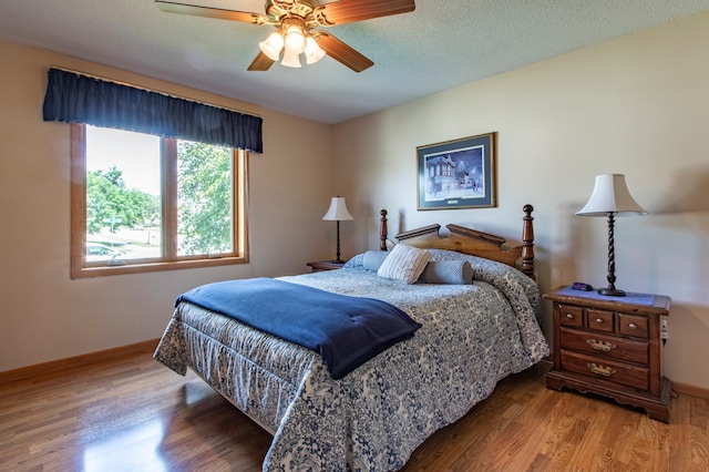 5551 Nancy Ln NW, Rochester, MN 55901 - bedroom with wood finished floors and a ceiling fan