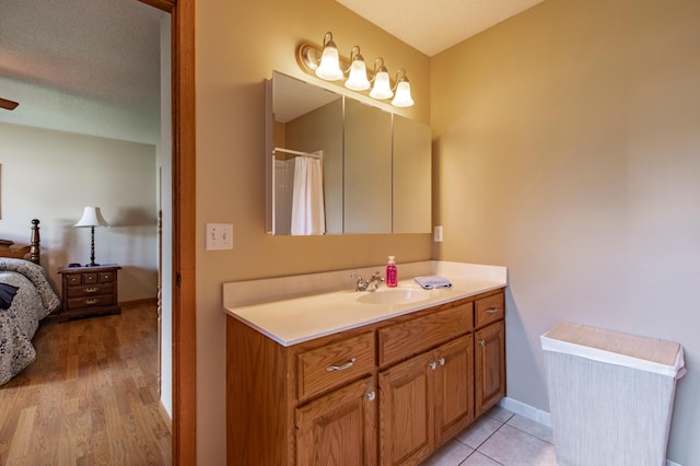 5551 Nancy Ln NW, Rochester, MN 55901 - bathroom with vanity and wood finished floors