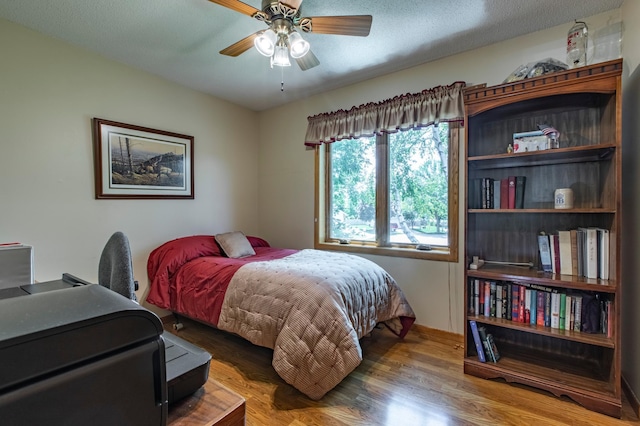 5551 Nancy Ln NW, Rochester, MN 55901 - bedroom with wood finished floors and a ceiling fan