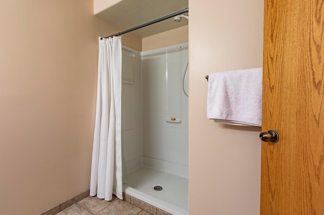 5551 Nancy Ln NW, Rochester, MN 55901 - bathroom featuring a shower with shower curtain and tile patterned flooring