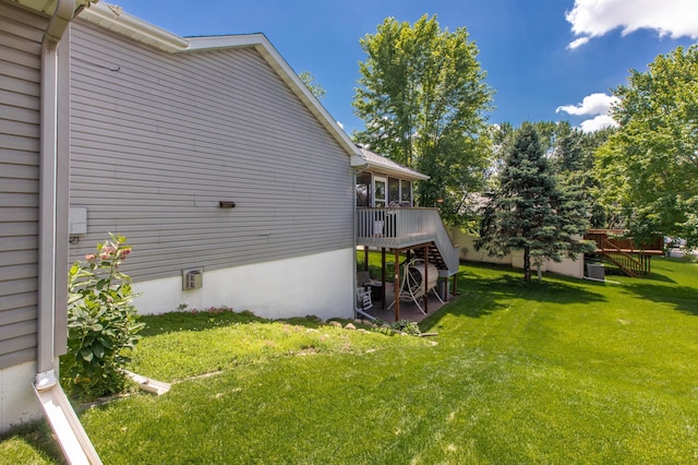 5551 Nancy Ln NW, Rochester, MN 55901 - view of side of home with stairs, a deck, and a lawn
