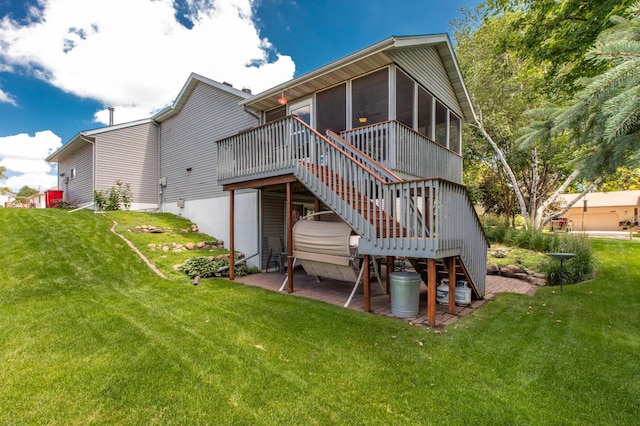 5551 Nancy Ln NW, Rochester, MN 55901 - back of property featuring a sunroom, a lawn, and stairs