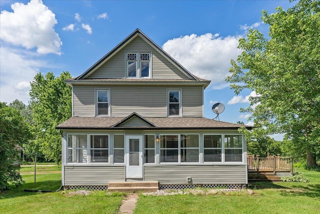 2694 State Road 64, Forest Twp, WI 54013 - view of front facade with a sunroom, a front yard, a wooden deck, and roof with shingles