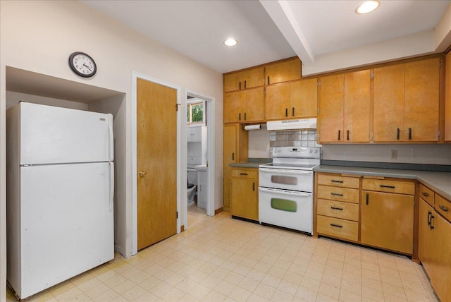 2694 State Road 64, Forest Twp, WI 54013 - kitchen featuring white appliances, under cabinet range hood, recessed lighting, brown cabinetry, and light floors