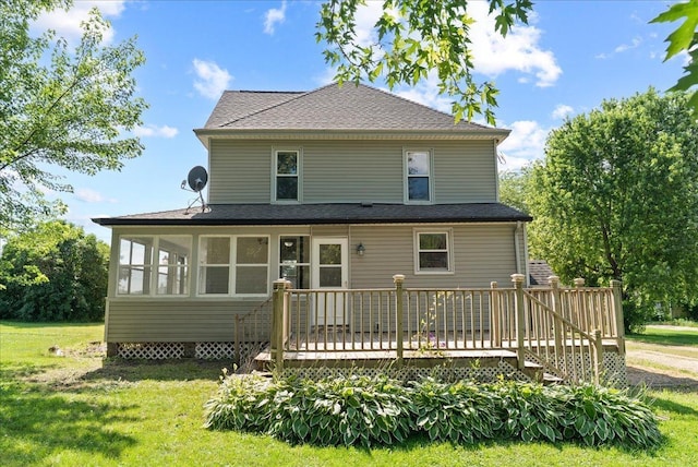 2694 State Road 64, Forest Twp, WI 54013 - rear view of property featuring a deck, a lawn, a shingled roof, and a sunroom