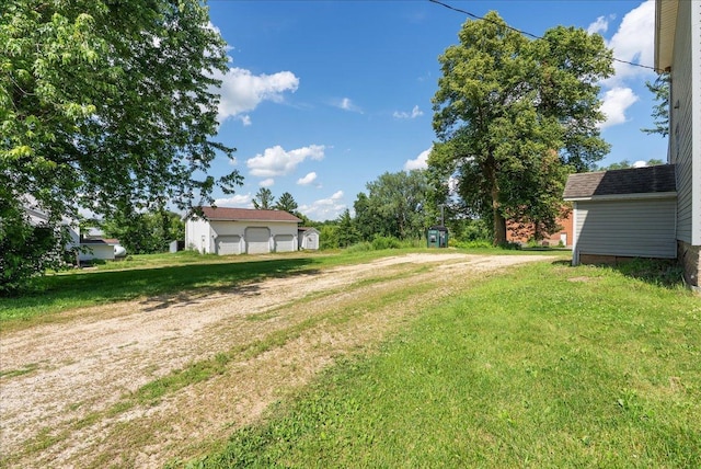 2694 State Road 64, Forest Twp, WI 54013 - view of green lawn with an outdoor structure and dirt driveway