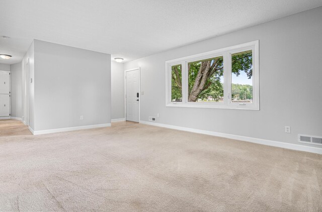 8210 Red Oak Dr, Mounds View, MN 55112 - unfurnished room featuring light carpet and baseboards
