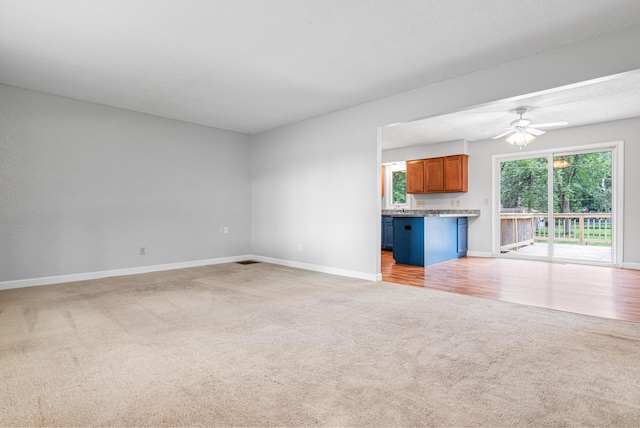 8210 Red Oak Dr, Mounds View, MN 55112 - unfurnished living room with light colored carpet and ceiling fan
