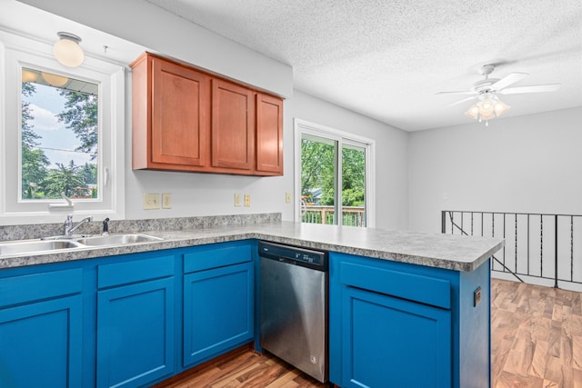 8210 Red Oak Dr, Mounds View, MN 55112 - kitchen featuring stainless steel dishwasher, a peninsula, light wood-type flooring, a ceiling fan, and blue cabinets