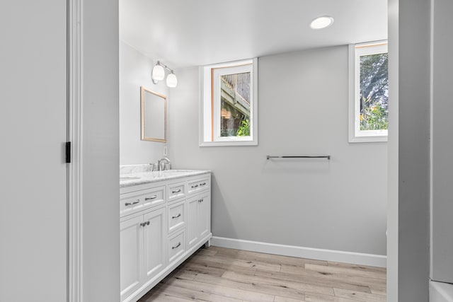 8210 Red Oak Dr, Mounds View, MN 55112 - bathroom with vanity and wood finished floors