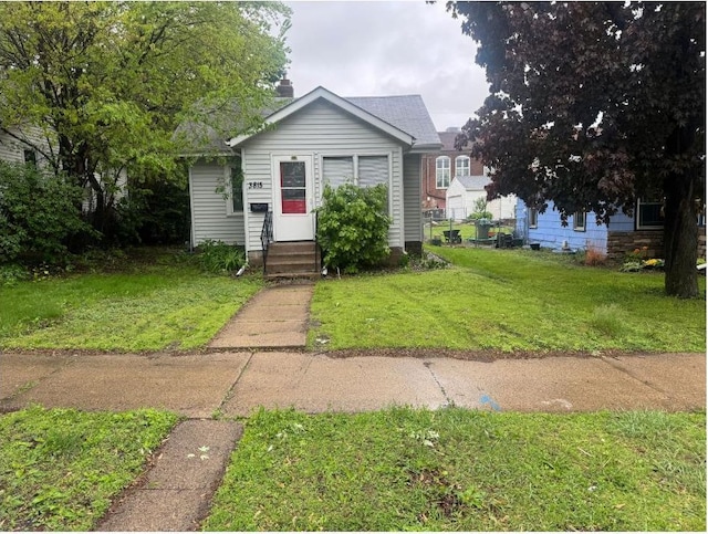 3815 Dupont Ave N, Minneapolis, MN 55412 - bungalow-style house with entry steps and a front lawn