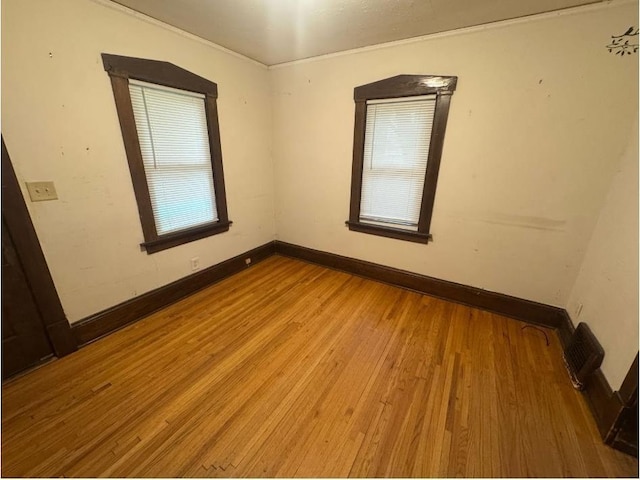 3815 Dupont Ave N, Minneapolis, MN 55412 - unfurnished room featuring wood finished floors and ornamental molding