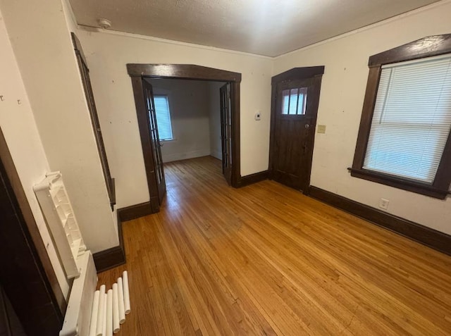 3815 Dupont Ave N, Minneapolis, MN 55412 - foyer entrance with light wood-type flooring and crown molding