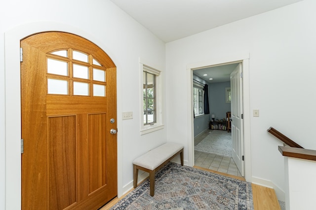 290 Wimbledon Hills Dr SW, Rochester, MN 55902 - entrance foyer with arched walkways and light wood-style floors