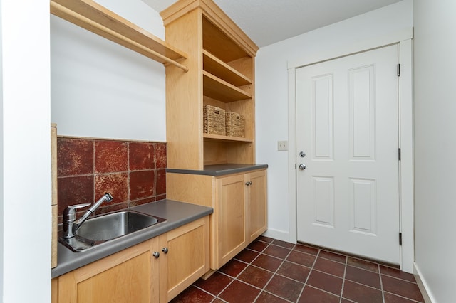 290 Wimbledon Hills Dr SW, Rochester, MN 55902 - washroom with a sink and dark tile patterned flooring
