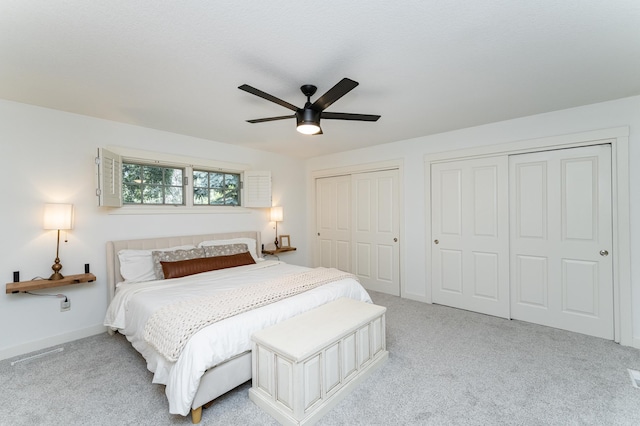290 Wimbledon Hills Dr SW, Rochester, MN 55902 - carpeted bedroom with multiple closets and a ceiling fan