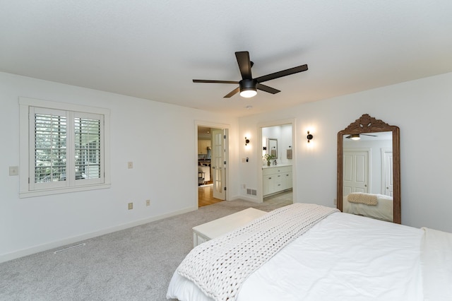 290 Wimbledon Hills Dr SW, Rochester, MN 55902 - bedroom with light colored carpet, ensuite bathroom, and a ceiling fan