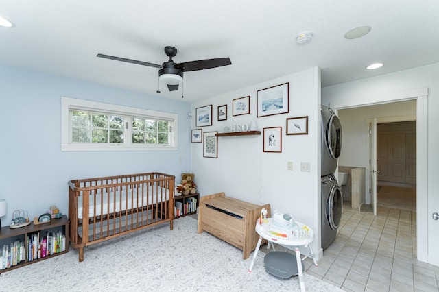 290 Wimbledon Hills Dr SW, Rochester, MN 55902 - bedroom featuring stacked washing machine and dryer, recessed lighting, a nursery area, and a ceiling fan