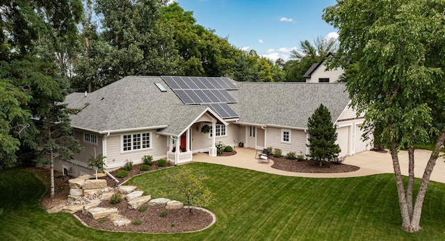 290 Wimbledon Hills Dr SW, Rochester, MN 55902 - view of front of property with roof with shingles, roof mounted solar panels, driveway, a front lawn, and a garage