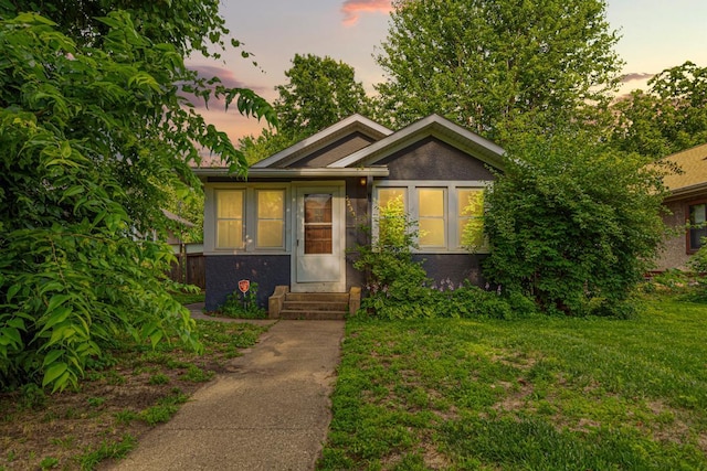 3233 42nd Ave S, Minneapolis, MN 55406 - view of front of property with entry steps, a front lawn, and brick siding