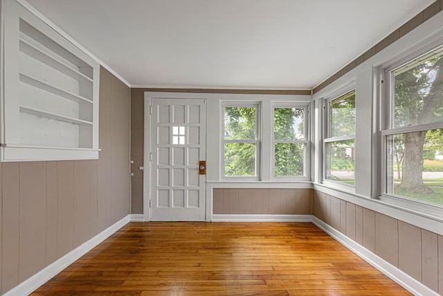 3233 42nd Ave S, Minneapolis, MN 55406 - unfurnished sunroom with hardwood / wood-style floors, wood walls, and crown molding