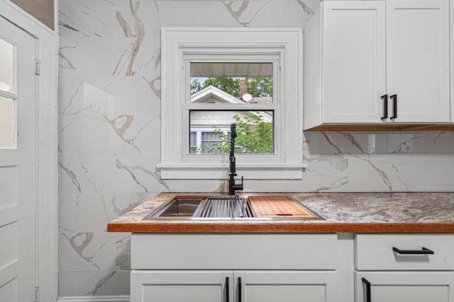 3233 42nd Ave S, Minneapolis, MN 55406 - kitchen view of backsplash, white cabinetry, and light countertops