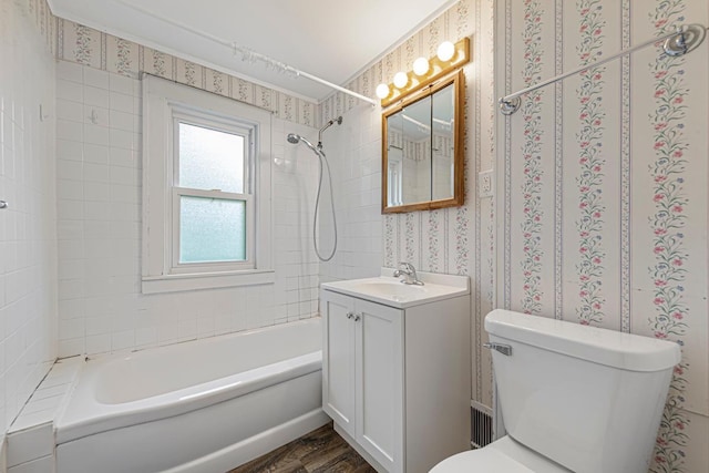 3233 42nd Ave S, Minneapolis, MN 55406 - bathroom featuring vanity, shower / bathtub combination, wood finished floors, and wallpapered walls