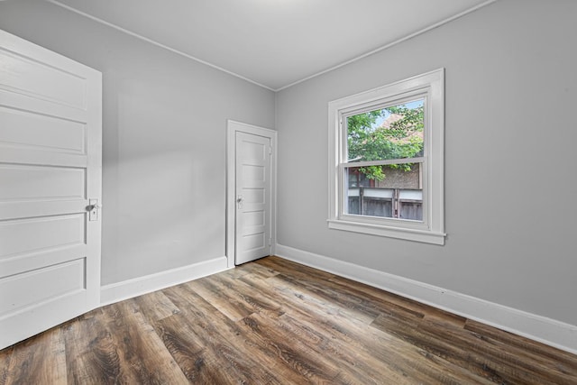3233 42nd Ave S, Minneapolis, MN 55406 - unfurnished room featuring dark wood-style flooring and ornamental molding