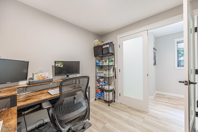 407 6th St NE, Barnesville, MN 56514 - office area featuring light wood finished floors and baseboards
