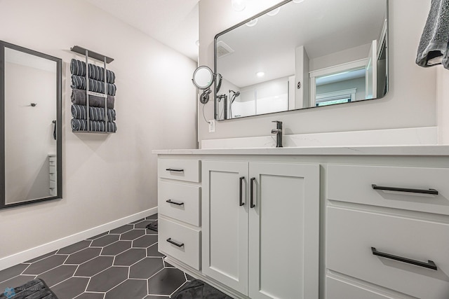 407 6th St NE, Barnesville, MN 56514 - bathroom with vanity and tile patterned floors