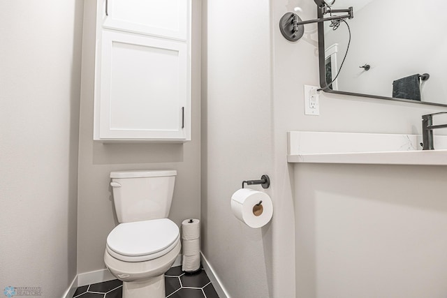 407 6th St NE, Barnesville, MN 56514 - half bathroom with toilet and tile patterned flooring