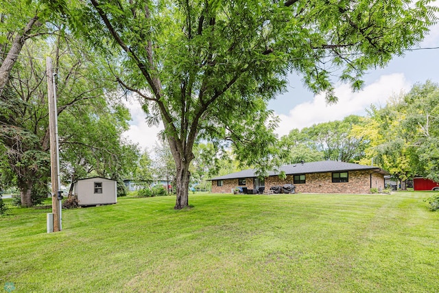 407 6th St NE, Barnesville, MN 56514 - view of green lawn with a storage shed