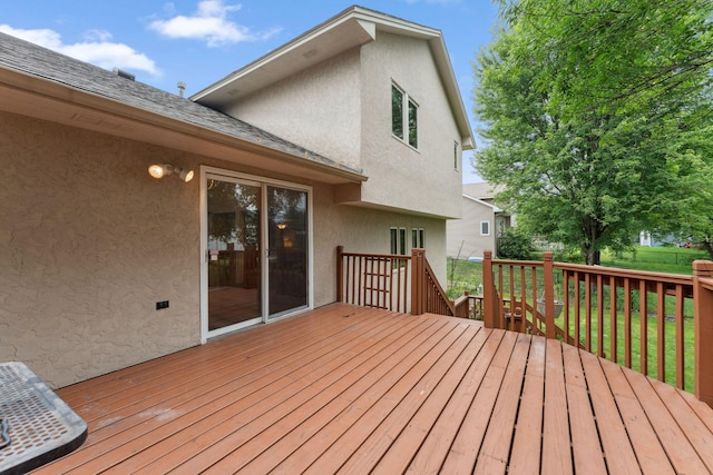 9055 Regent Pkwy, Brooklyn Park, MN 55443 - wooden deck with a lawn