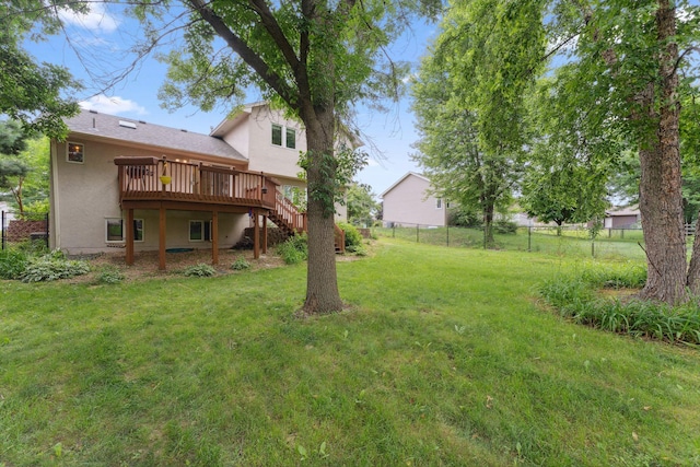 9055 Regent Pkwy, Brooklyn Park, MN 55443 - view of yard featuring stairway and a wooden deck