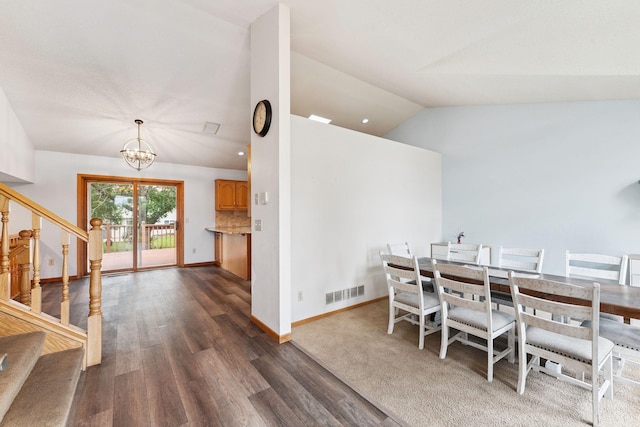 9055 Regent Pkwy, Brooklyn Park, MN 55443 - dining room featuring a chandelier, stairway, dark wood-style floors, and lofted ceiling
