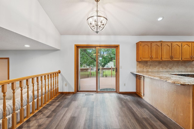 9055 Regent Pkwy, Brooklyn Park, MN 55443 - doorway with dark wood-style flooring, a chandelier, lofted ceiling, and recessed lighting
