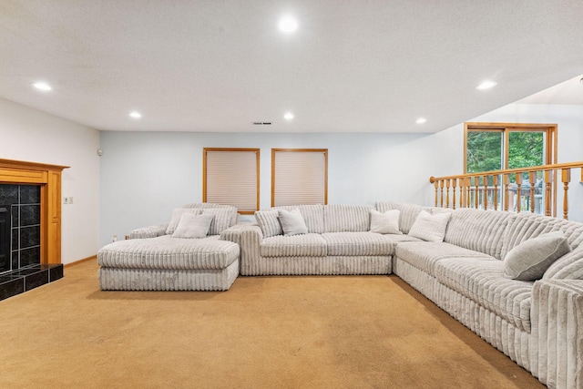 9055 Regent Pkwy, Brooklyn Park, MN 55443 - living room featuring carpet floors, recessed lighting, and a fireplace